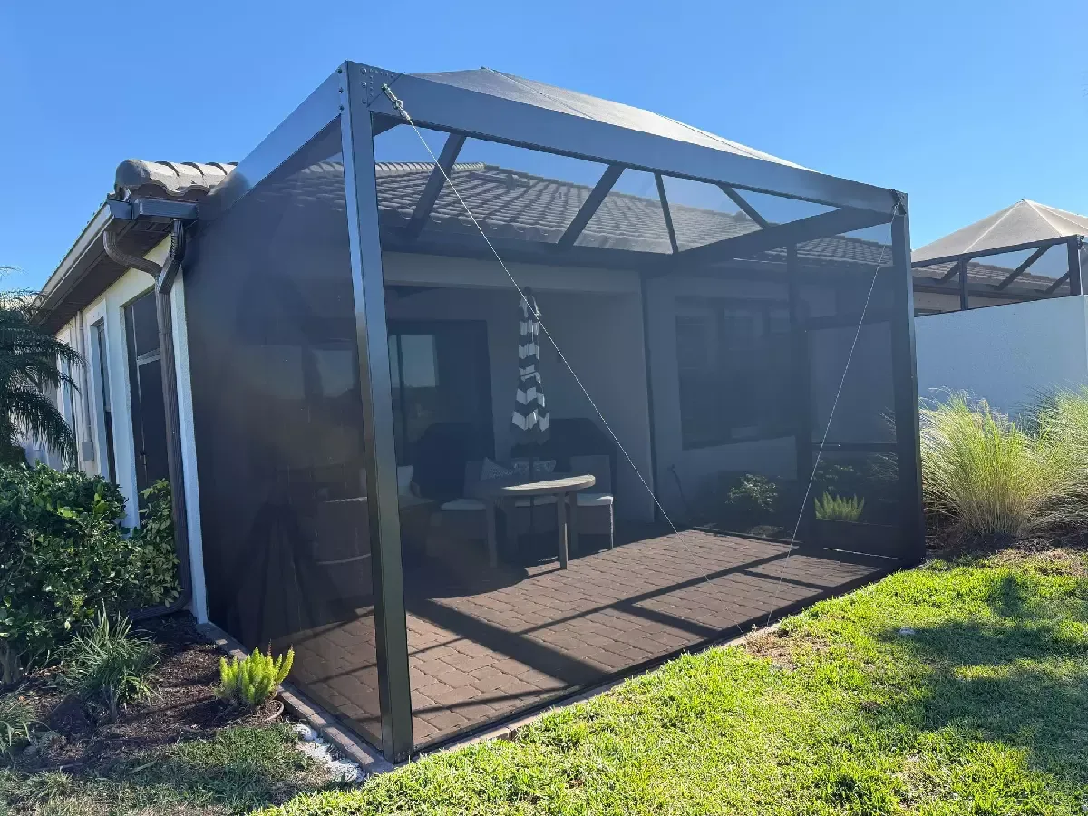Interior view of a screened lanai with a finished paver surface in Bradenton, Florida