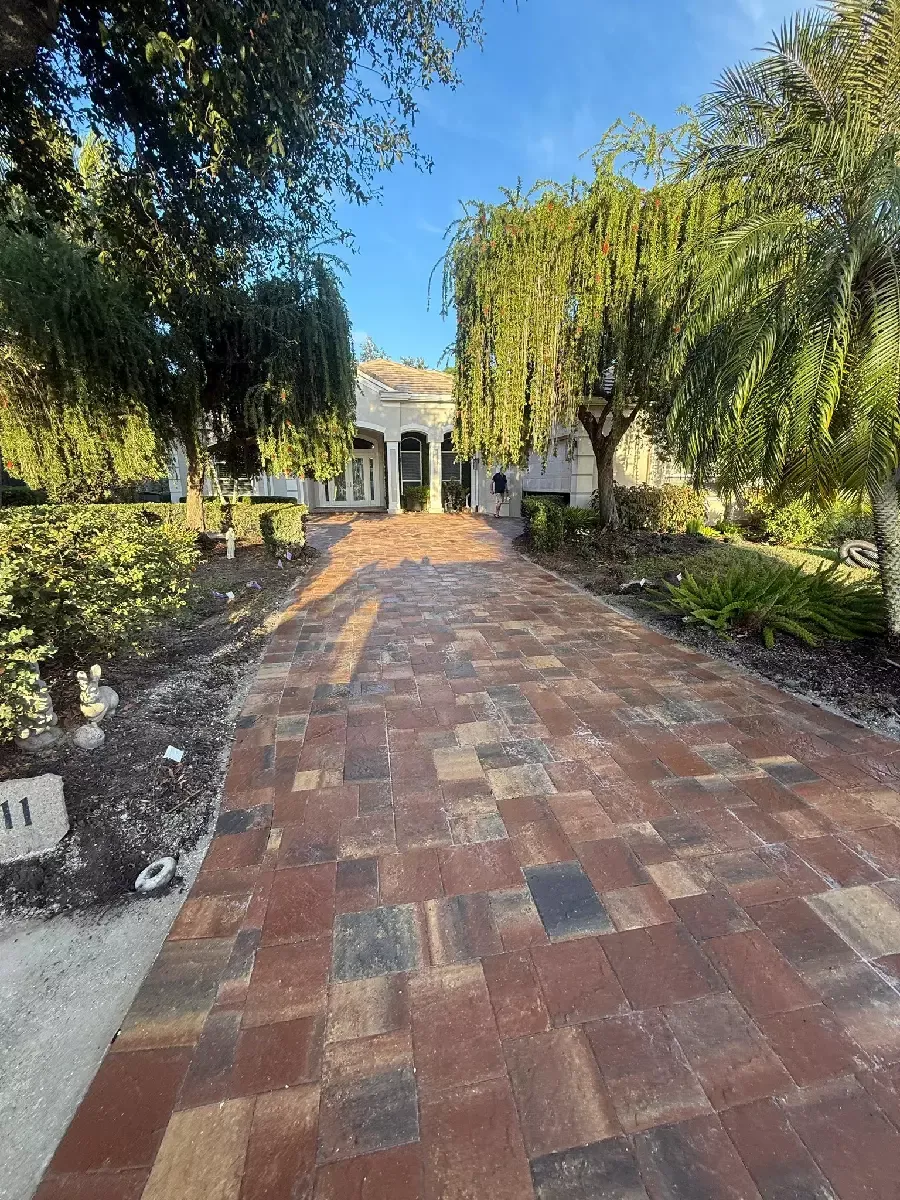 Red brick paver driveway leading to a home in Bradenton, Florida