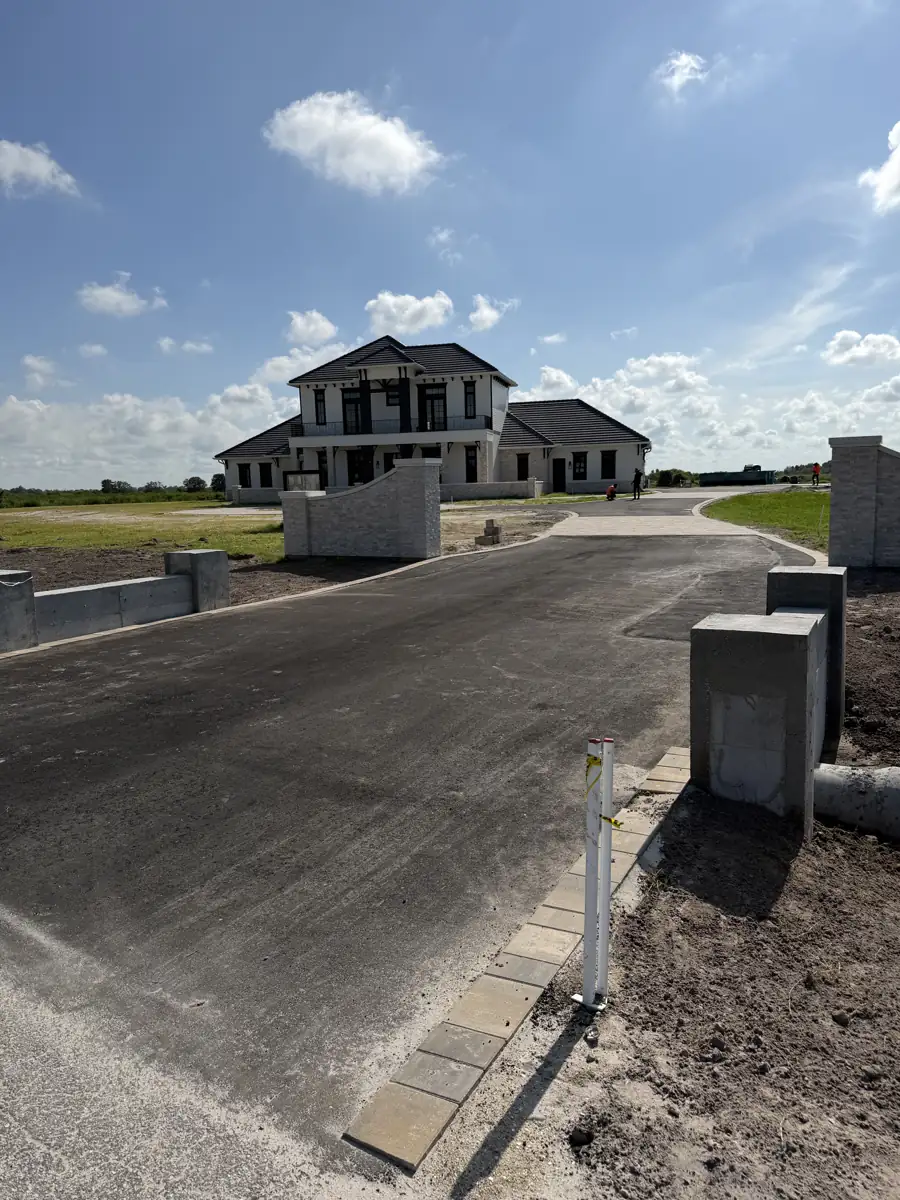 Paver inlay entrance approaching a new construction model home in Myakka City, Florida