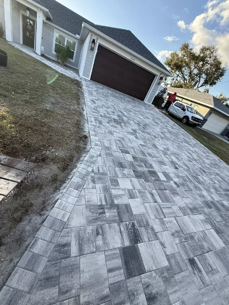 Completed concrete paver driveway with a contrasting border at a Nokomis, Florida residence