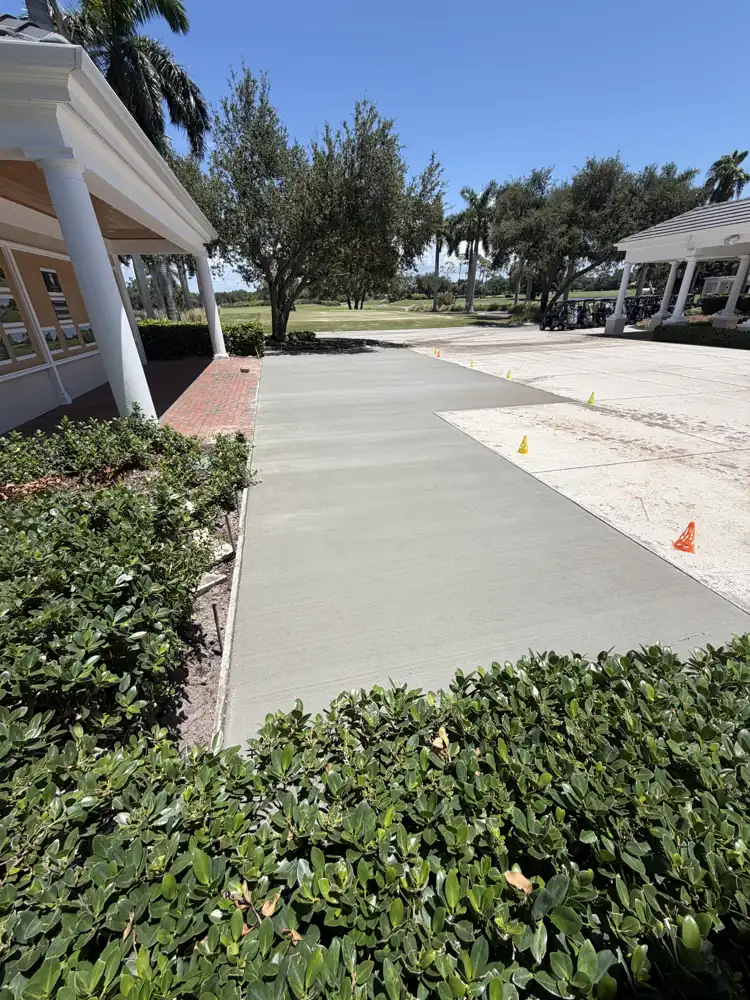 Regraded and repoured clubhouse walkway at The Oaks Club in Osprey, Florida