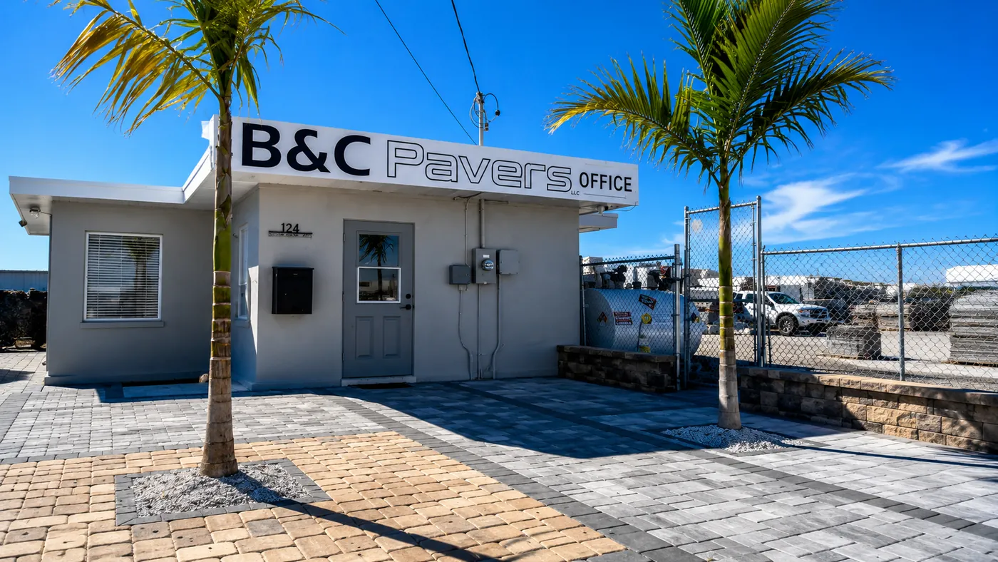 Concrete paver display area at B&C Pavers headquarters in Venice, Florida with palm trees