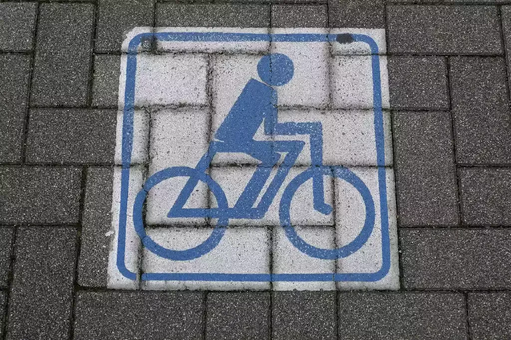 Commercial paver surface with a painted bike lane marking in Venice, Florida