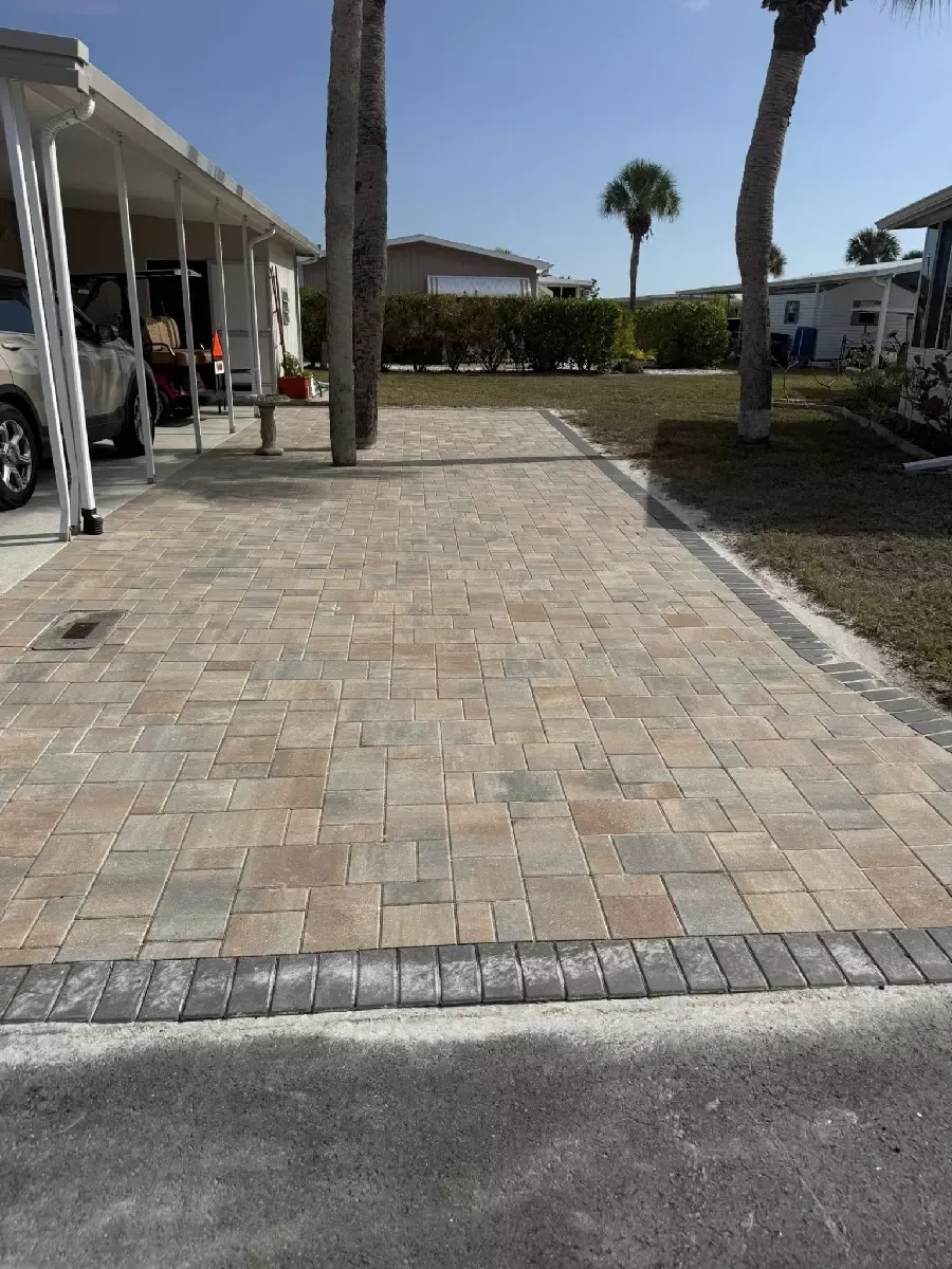 Concrete paver surface installed under a residential carport in Venice, Florida