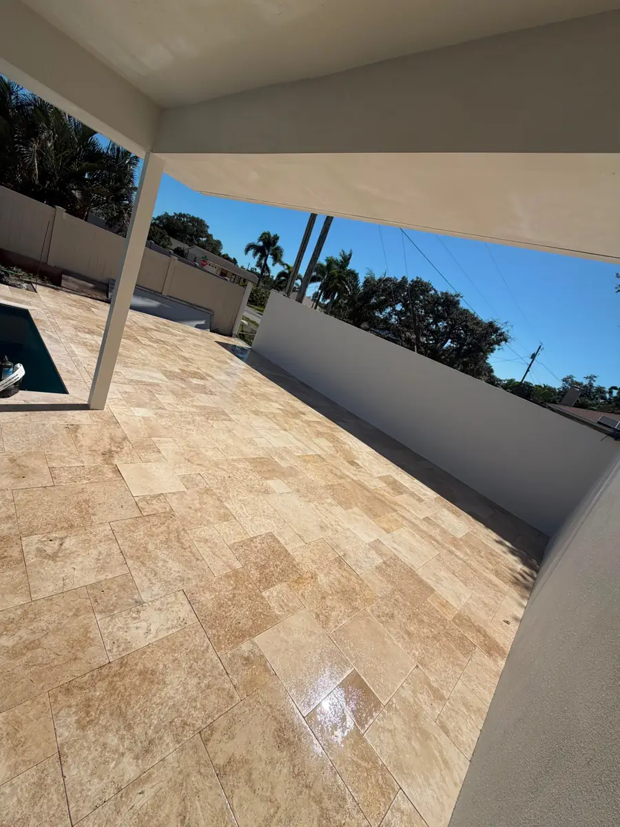Ivory French-pattern travertine patio in Venice, Florida